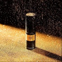 Gold Dust de la marca David Mallett: Fondo negro con particulas doradas sobre producto